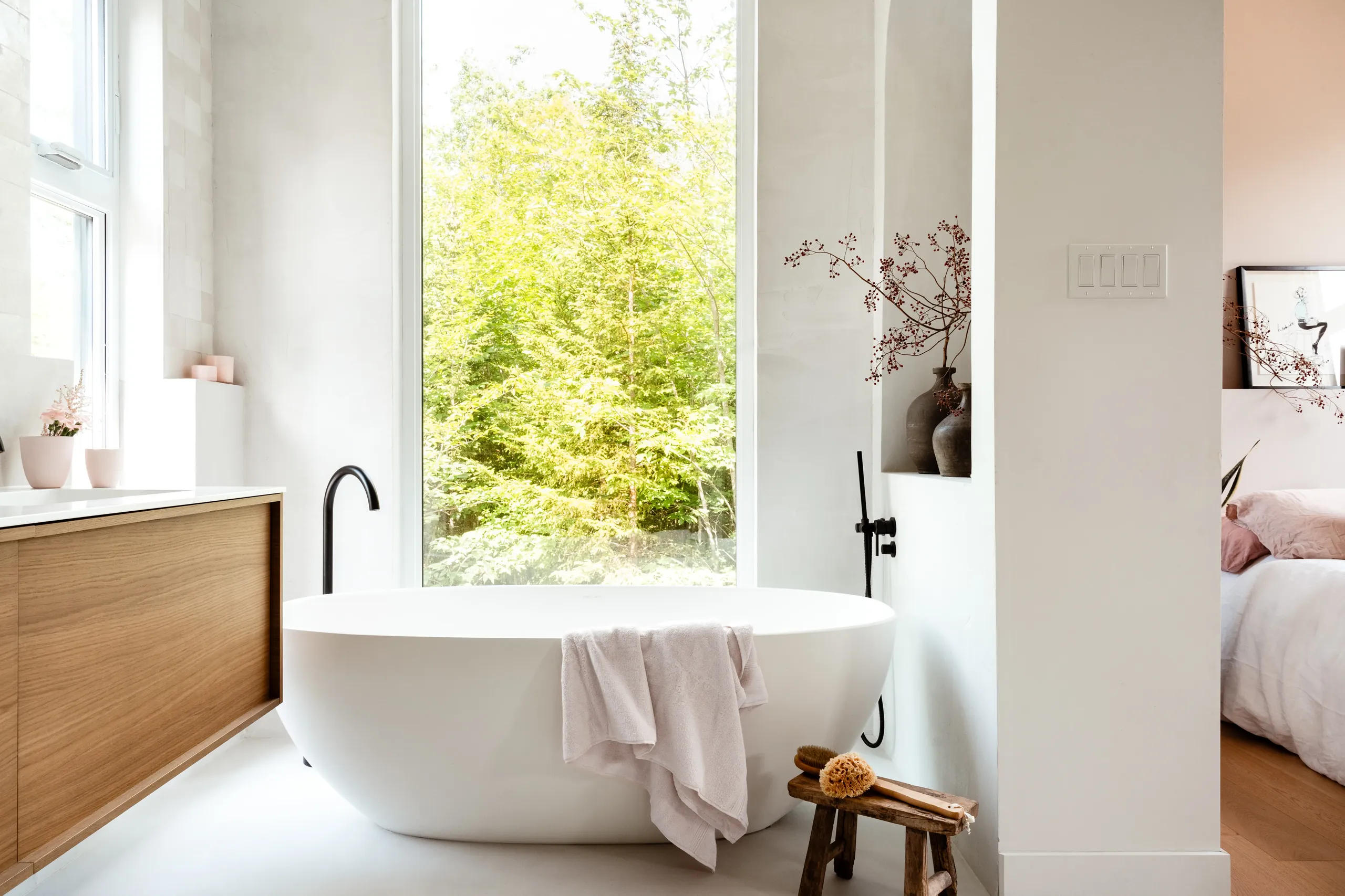 Vanity detail in the main bathroom of a Laurentian chalet, with natural stone and walnut cabinetry.