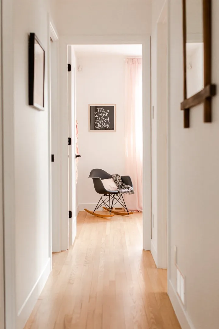 Teenager's bedroom in the Montreal bungalow — neutral palette, custom desk, display shelving.