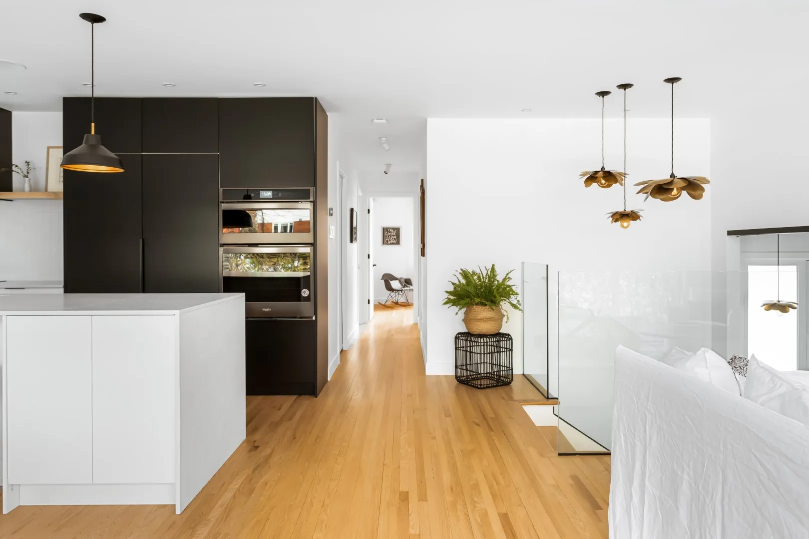 Kitchen counter detail with integrated cooktop — Montreal bungalow renovation.