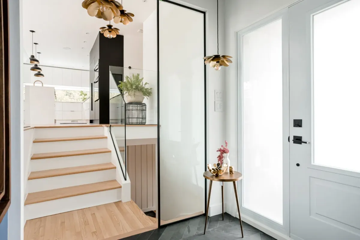 Entry of the Montreal bungalow — oak floors extending into the open-plan living area.