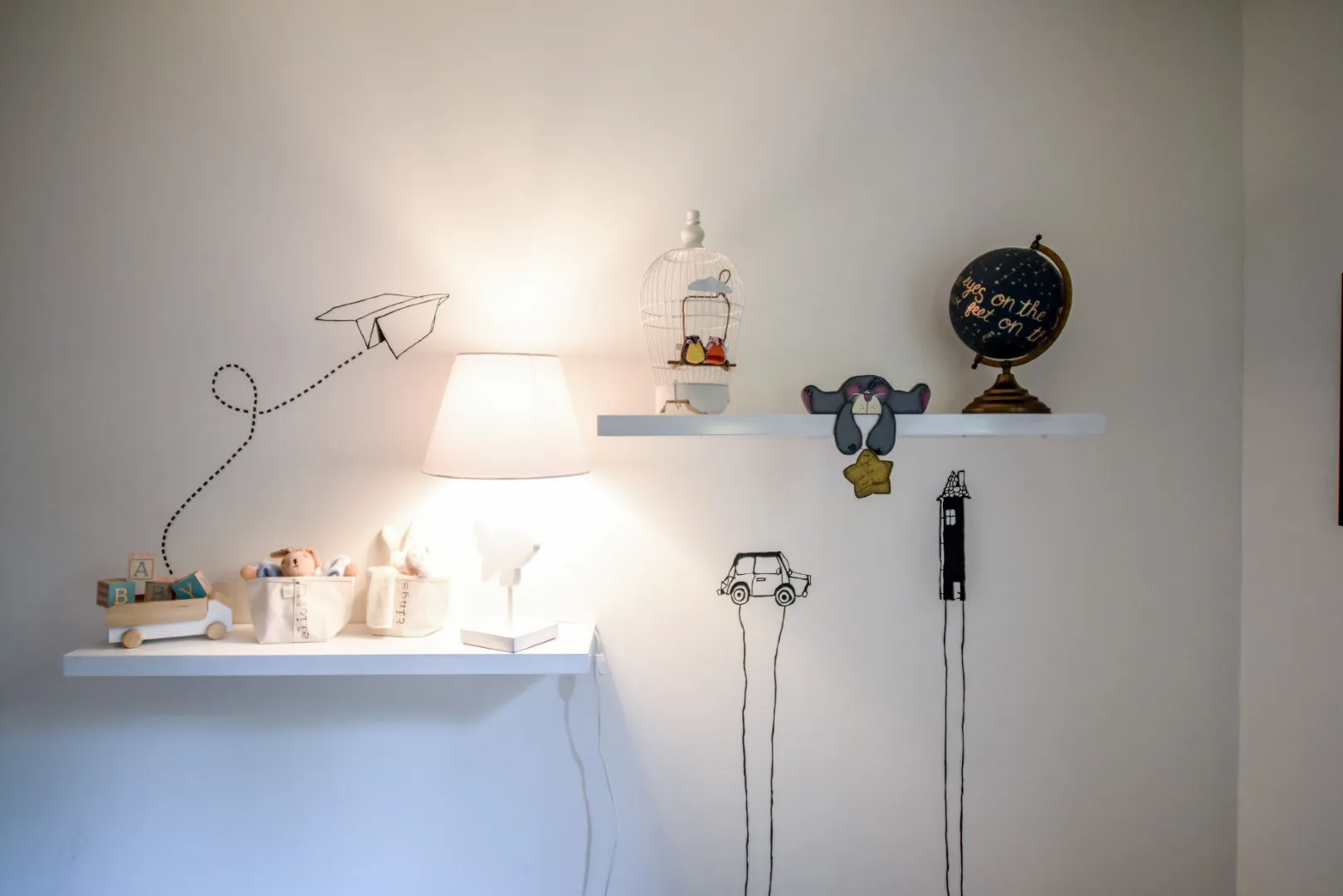 Kid's bedroom corner — playful art and warm wood, Montreal cottage.