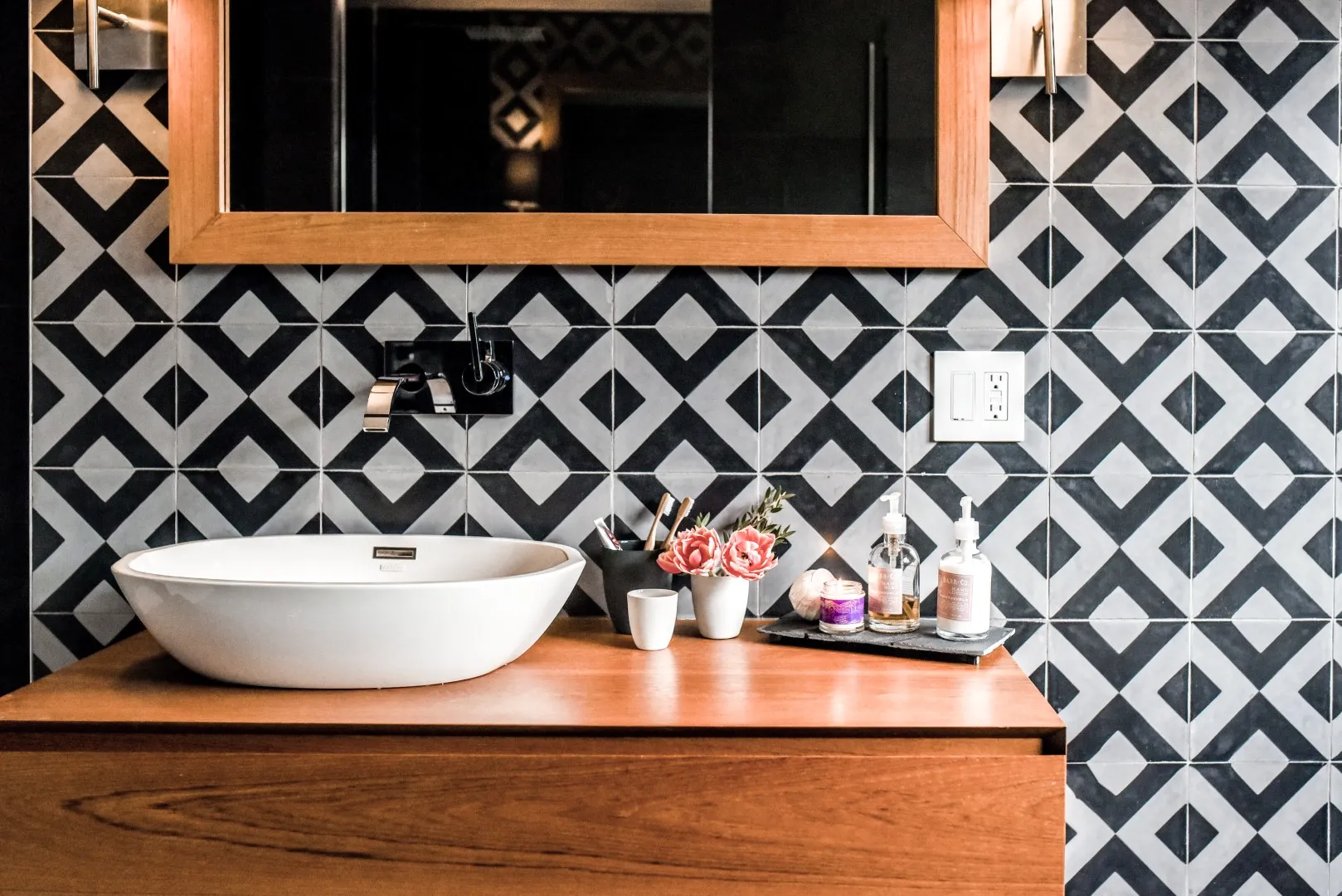 Family bathroom in the Montreal cottage — wall-hung toilet and tile detail.