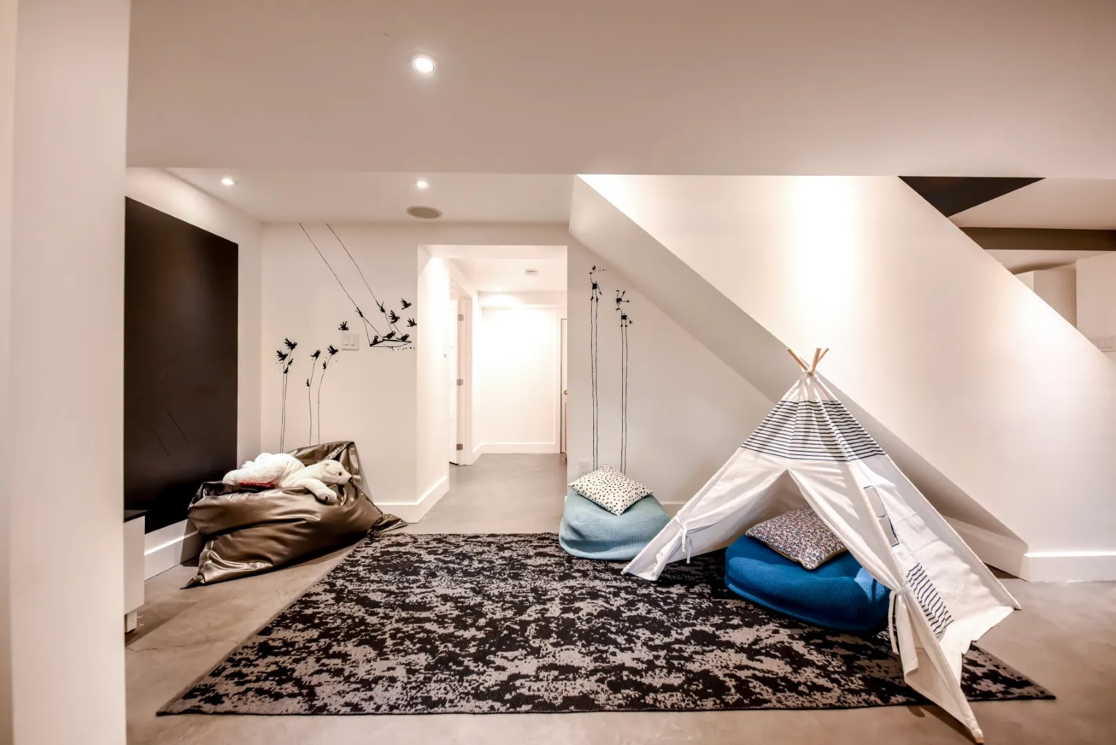 Wide view of the basement playroom — Montreal cottage.