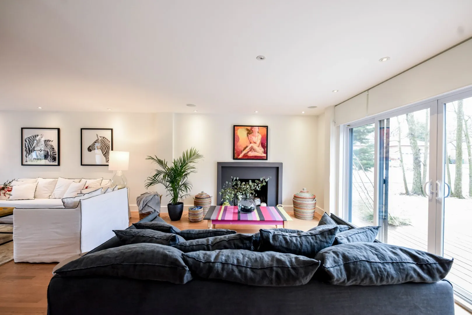 Family room in the Montreal cottage — informal seating and warm oak floors.