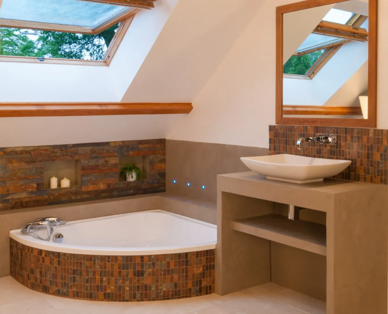 Bathroom in a Versailles new build — slate wall with backlit niches and waxed-concrete tub surround.